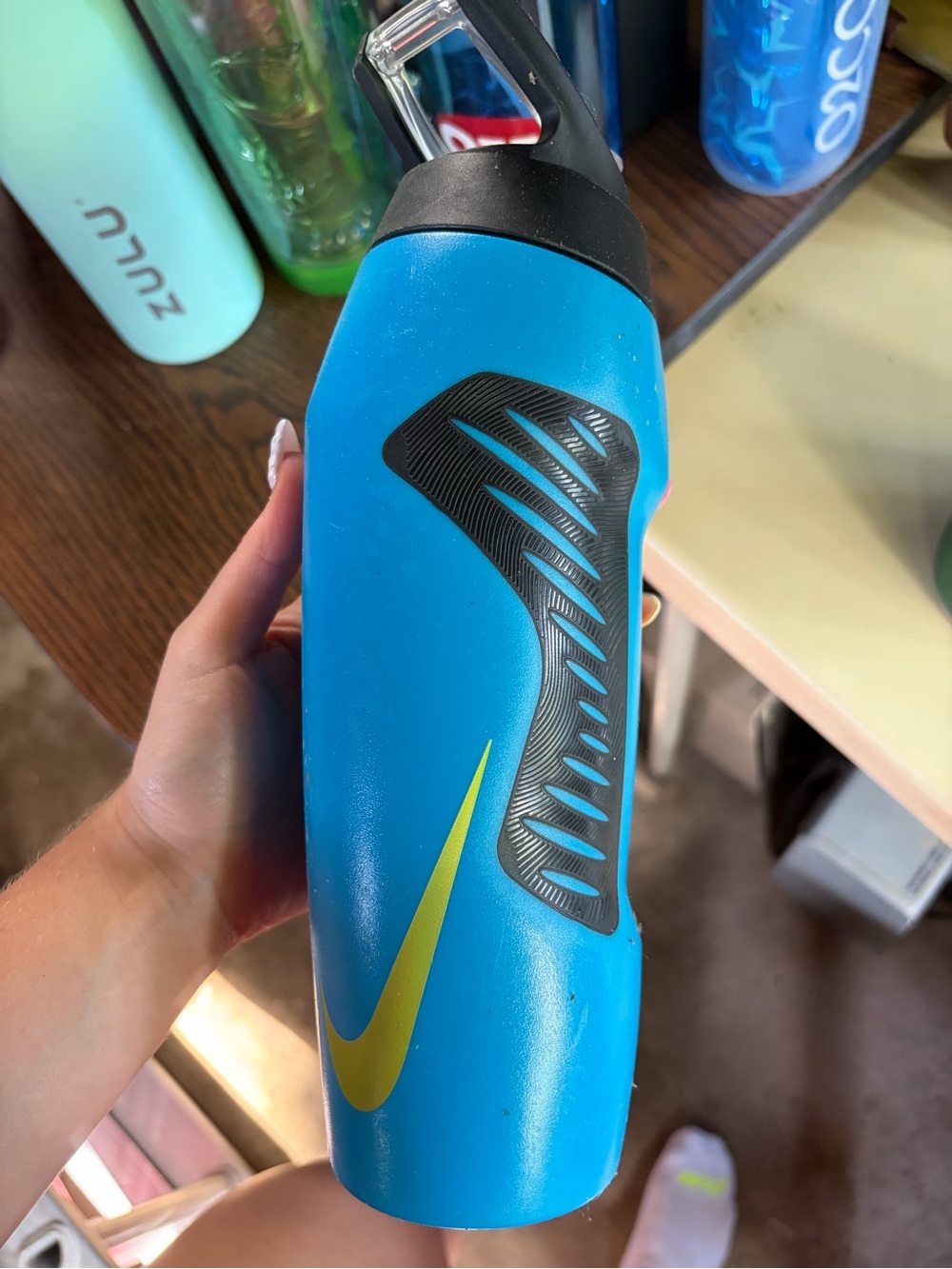 Nike Blue Water Bottle with Black Grip and Yellow Swoosh